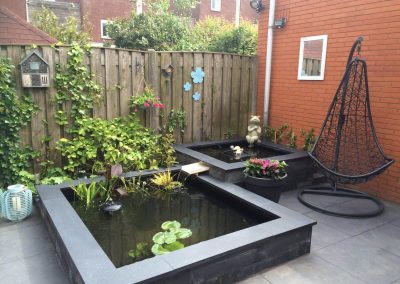 Aanleg vijverpartij tuin Goirle